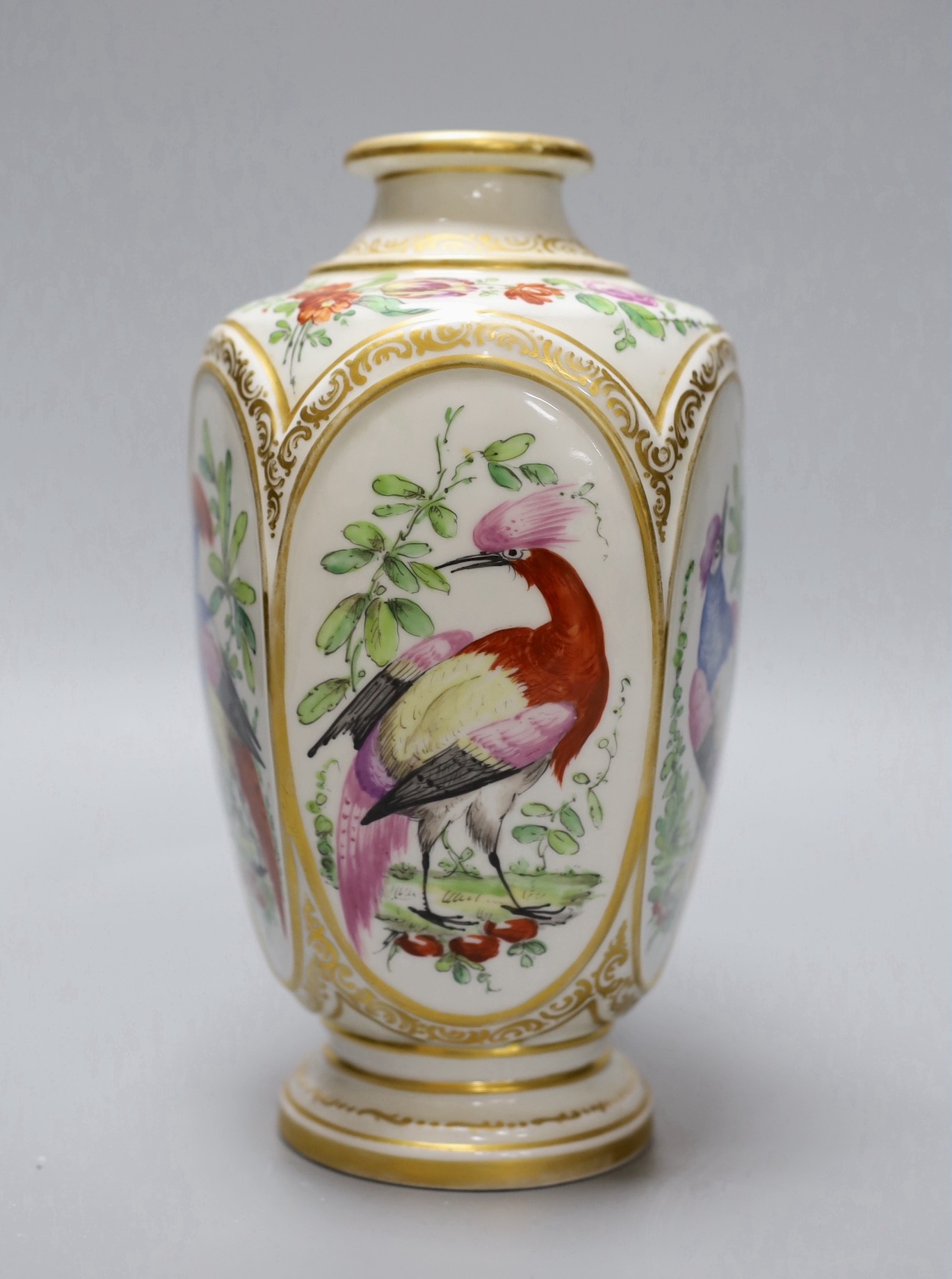 A late 19th century French porcelain vase, in Chelsea style, decorated with birds of paradise, 22 cms high